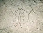 This petroglyph was created prior to the arrival of the horse. It shows a warrior carrying a body shield