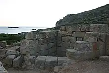 Short brick structure by the sea