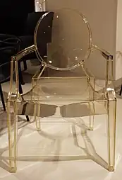 Louis Ghost, a simplified reinterpretation of armchairs in the Louis XVI style; by Philippe Starck; 2009; polycarbonate; height: 94 cm; various locations