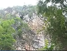 At the bottom of Ban Phou Pheung Noi, the only way to reach the other side of the Nam Ngum river during the rainy season is to climb the above cliffs.