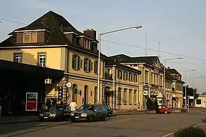 Two-story station building with multiple rooflines