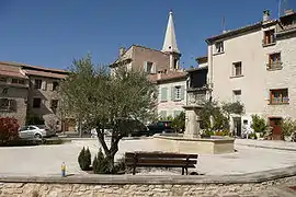 The village square with a fountain, in Saint-Didier