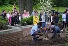 Families from the British Embassy Washington planted trees along Massachusetts Avenue to mark Her Majesty The Queen's Platinum Jubilee