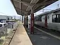 View of Platform 1 looking west, in the direction of Haiki. Note there is a siding branching off the track.