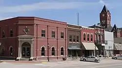 The Plattsmouth Main Street Historic District is listed in the National Register of Historic Places.  At upper right is the clock tower of the Cass County Courthouse.