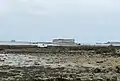 Fort Enet at low tide, with Fort Boyard (left) and Fort de la Rade on Île-d'Aix (right) in the background.