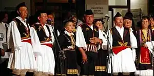 Greek polyphonic group from Dropull wearing skoufos and fustanella