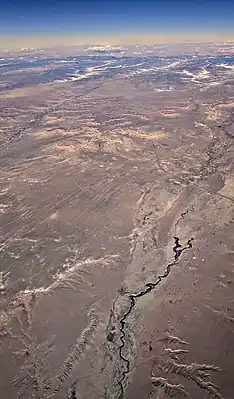 Polacca Wash, crossed by Arizona Route 87, with First Mesa and Second Mesa visible in the distance