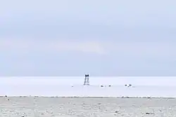 View of the remains of abandoned Izluchina Russian polar station at the northern end of Komsomolets Island