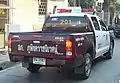 Thai Police vehicle in maroon and white