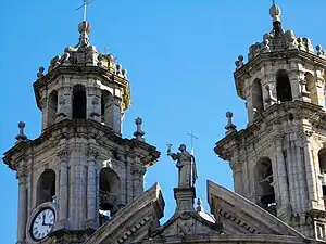 Figure of Faith in the centre of the split gable and twin towers