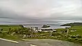 Port Duntulm (2015) on the Island of Skye in the Inner Hebrides. Duntulm is a crofting township. Sheep can be seen in the distance, held in stone-walled enclosures.