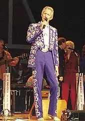 Porter Wagoner wearing elaborate Nudie suit