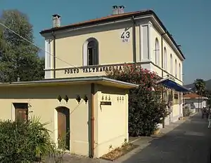 Stuccoed two-story building with gabled roof