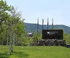 The entrance sign in summer