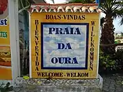 Welcome sign on the promenade  to the rear of the beach