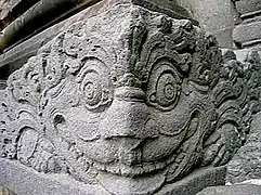 Corner antefix carved as a Kala head