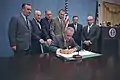 President Johnson signs a bill authorizing education programs for children with disabilities; from left to right: Hugh L. Carey, Dominick V. Daniels, Carl D. Perkins, Albert H. Quie, Winston L. Prouty, Cohen (1968)