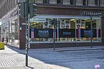 Trump and Putin's welcoming posters were visible in the street scene.