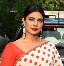 A photograph of Priyanka Chopra looking towards the camera