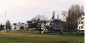 Historic buildings behind a flag pole