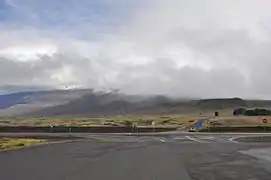 The entrance to the Mauna Kea access road for the Onizuka Center for International Astronomy and Mauna Kea Observatories.