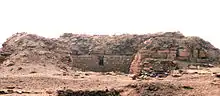 Low ruins in the desert, looking like a wall