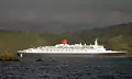 QE2 slips out the entrance in a following breeze, 2006