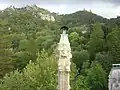 One of the chimneys. The Castle of the Moors and the Pena Palace are visible atop the hills.