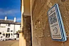 Ceramic plaque with QRpedia code for Shire Hall, as part of the MonmouthpediA project