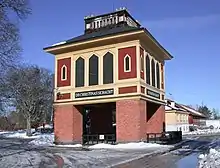 A small, elaborately-decorated tower