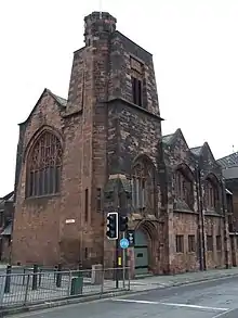 Red sandstone church building designed by Charles Rennie Mackintosh