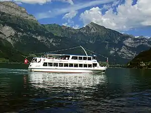 Ship floating on lake