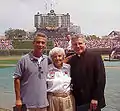 Coughlin with his mother Louise Coughlin and Rahm Emanuel,  Wrigley Field, 2003