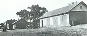 The residence (left) and the garage (1930s).