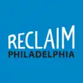 White text reading "Reclaim" and black text reading "Philadelphia" are overlaid over a blue background.