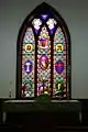 The altar and central stained glass window