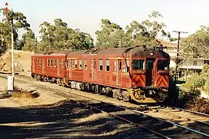 Two Redhen railcars working a Belair to Adelaide local train during the late 1980s approaching Lynton