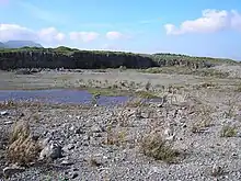 A former quarrying landscape, with level ground and a small pond