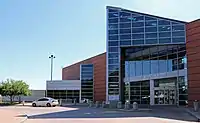 A picture of the front of the terminal building. A sign above the door reads, "Rocky Mountain Metro."