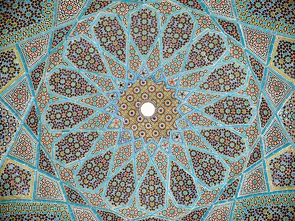 Geometric arabesque tiling on the underside of the dome of Hafiz Shirazi's tomb in Shiraz, Iran