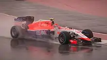 A picture of Alexander Rossi driving a Marussia MR03B Formula One car during the 2015 United States Grand Prix.