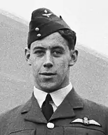 A black and white photograph of a man in uniform