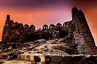 A view of ruined fort of Tughlaqabad during sunset