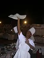 A chef preparing rumali roti in India