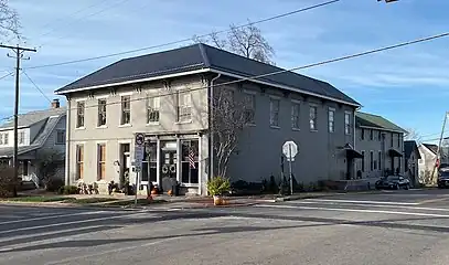 Built c.1850s this commercial building in Rushville, OH was once used to store and dry tobacco in the early 19th century. It was later used as a carpentry and cabinet shop and funeral home.