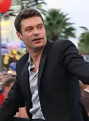 Ryan Seacrest, executive producer, wearing a black blazer in 2009