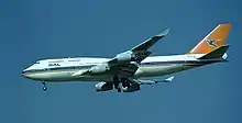 A Boeing 747-400 "ZS-SAW" painted in the pre–1997 orange, blue and white livery, and featuring the Afrikaans name of the airline SAL (Suid-Afrikaanse Lugdiens).