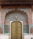 Multifoil arch with mural on lotus gate, City Palace, Jaipur, India. An example of Rajput architecture, built between 1727-32.