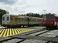 X2234 at Sarlat station with a trailer next to it.